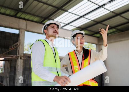 team engineer, foreman, architect meeting for colleagues discussing and checks construction blueprints at onsite Stock Photo