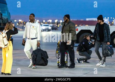 Las Vegas, USA. 04th Feb, 2024. Kansas City Chiefs Defensive Tackle Chris Hones (L) walks along the tarmac during Super Bowl 58 team arrivals at the Harry Reid International Airport in Las Vegas, Nevada on February 4, 2024. (Travis P Ball/Sipa USA) Credit: Sipa USA/Alamy Live News Stock Photo