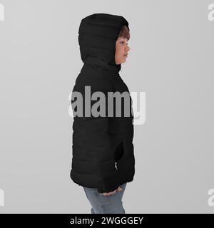 Mockup of a black winter kids puffer jacket on a girl in hoodie, side view, isolated on background. Template of fashionable streetwear with zipper on Stock Photo