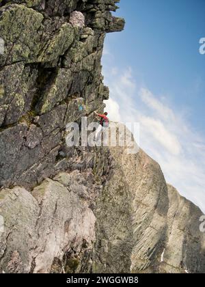 A hiker traverses the Knife Edge on Maine's Mount Katahdin. Stock Photo