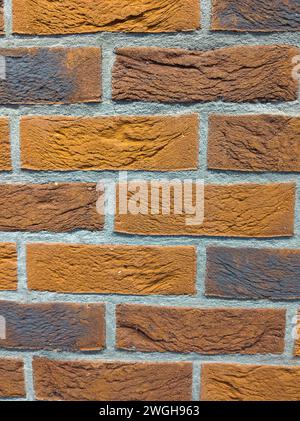 orange brick wall with detailed grooves Stock Photo