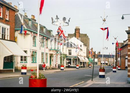 Flags and bunting decorating the street for Queen Elizabeth  Silver Jubilee celebrations 1977, Southwold, Suffolk, England, UK Stock Photo