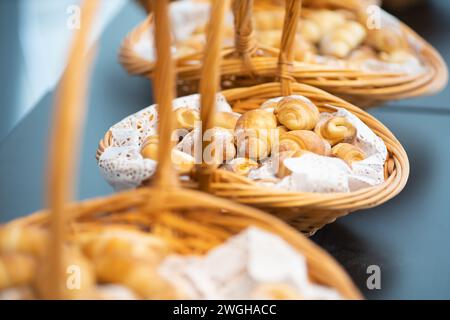 sweet croissants arranged in baskets Stock Photo