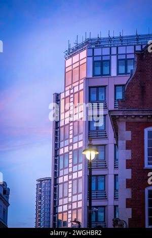 Reflection of pink sky on a glass building, Covent Garden, London, England, UK Stock Photo