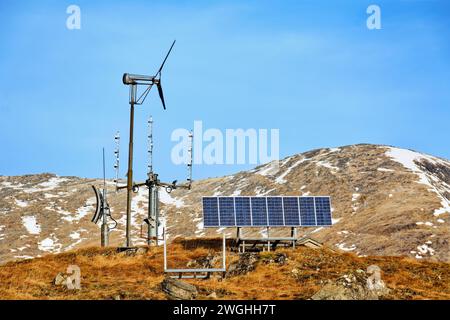 Weather station with solar panels and hills with snow in winter on the West Coast of Scotland Stock Photo