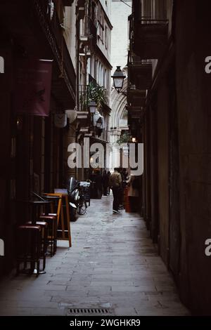 Narrow and typical street of the Gothic neighborhood of Barcelona in Catalonia, Spain, on January 16, 2021 Stock Photo
