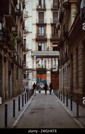 narrow street in the Gracia neighborhood in Barcelona in Catalonia, Spain, on January 16, 2021 Stock Photo