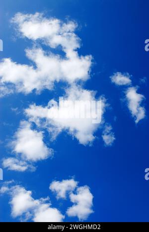 white fair weather clouds in the blue sky Stock Photo