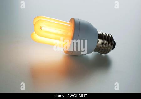 warm light of a luminous energy-saving lamp Stock Photo