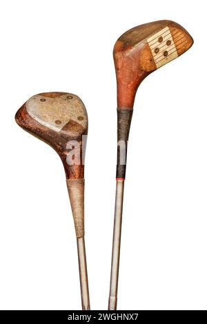 Two weathered ancient golf clubs isolated on a white background Stock Photo