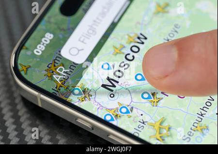 New York, USA - January 24, 2024: Air traffic in Moscow city  on iphone 15 pro max screen close up view Stock Photo