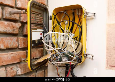 A switchboard with an electrical connecting cables and wi-fi router box. Stock Photo