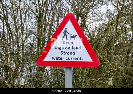 Keep dogs on lead, Strong water current, traffic warning sign in Cheshire UK Stock Photo