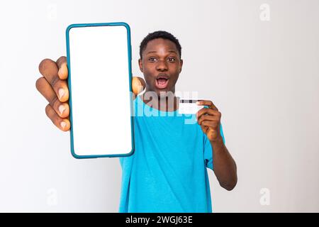 man showing phone screen and holding credit card Stock Photo