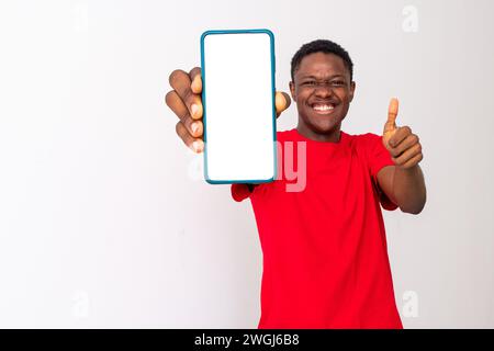 excited young back man shows blank, large phone screen Stock Photo