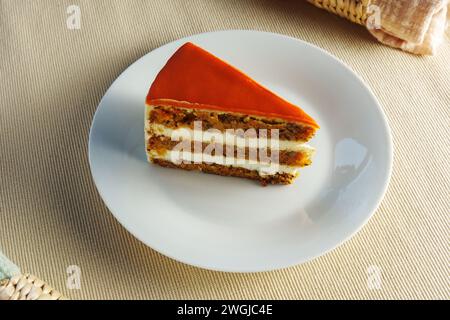 Deliciously Moist Carrot Cake Served on a Clean, White Plate Stock Photo