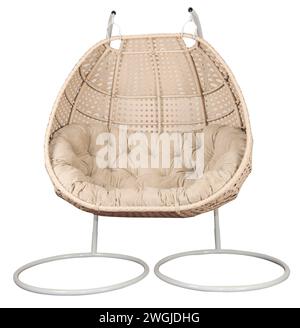 Rattan wicker swing chair with a pillow. Comfortable furniture for garden or lounge area. Stock Photo