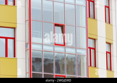 Geometric reflections created by sunlight on the glass windows of a contemporary urban structure. Stock Photo