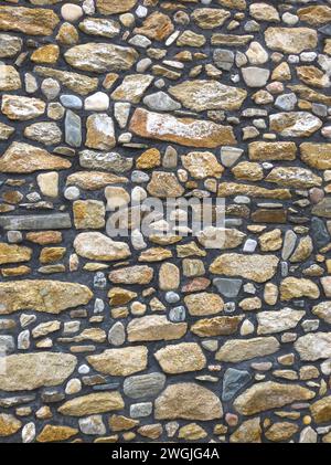 stone wall made out of irregular pieces Stock Photo