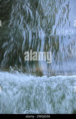 Part view of a waterfall , the flowing water and the foam Stock Photo