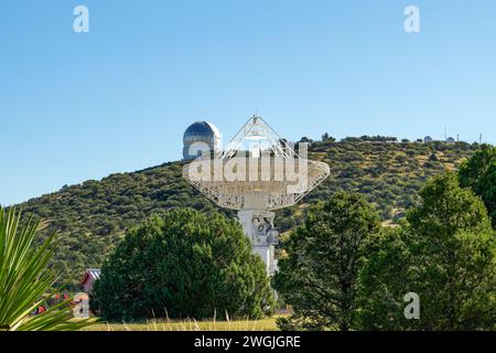 Fort Davis, TX - Oct. 11, 2023: 12 meter wide radio telescope with Hobby-Eberly telescope behind in the background at the University of Texas McDonald Stock Photo