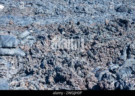 Variety of forms of basalt solidified lava: interfluent lava current among other formations, ropy lava ,agglomerate with slag lava with fragmentary sc Stock Photo
