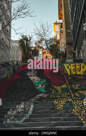 The street art displayed on steep hill near historic apartment building in Istanbul, Turkey Stock Photo