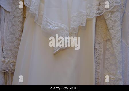 Vintage antique wedding dresses fabric details background. Stock Photo