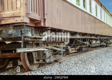 under the wheels of a rusty vintage railway cart from the Rhodesian era Stock Photo