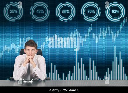 Trader man sitting in office with spreadsheet, stock and percentage charts on virtual screen.  Investment and cyberspace concept. Stock Photo