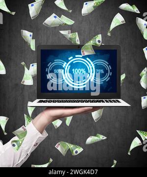 Businessman hand holding laptop with preadsheet, analytics data and percentage charts. Falling euro bills. Analytics and exchange concept. Close up Stock Photo