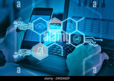Businessman hands using laptop and virtual hexagons hologram with digital business icons. Virtual reality and global networking concept. Stock Photo