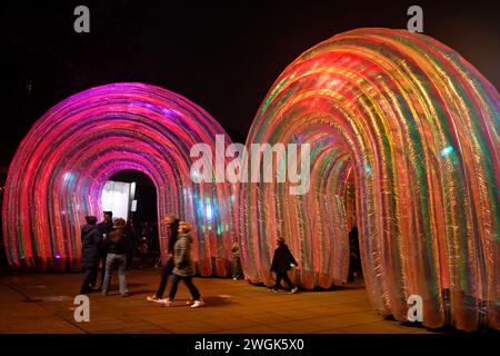 Series of giant inflatable arches at night, “Elysian” by Atelier Sisu part of Bristol Light Festival 2-11 Feb 2024 with visitors Stock Photo