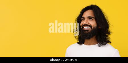 Curious young indian man looking at free space Stock Photo