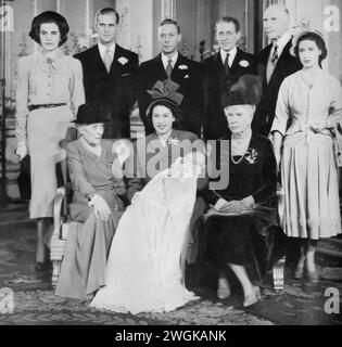 Portrait from the christening of Charles III, featuring key members of the British royal family and relatives. In this photograph, Princess Elizabeth II and Prince Philip are present along with King George VI, Queen Elizabeth (the Queen Mother), Queen Mary, Lady Brabourne, David Bowes-Lyon, and Princess Margaret. This significant event, marking a key moment in the life of the future King Charles III, brings together multiple generations of royalty, reflecting the rich heritage and continuity of the British monarchy. Stock Photo