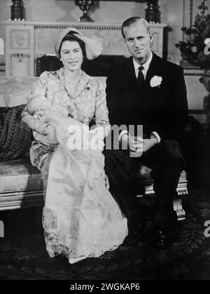 A portrait of Elizabeth II, Prince Philip, and their newborn daughter, Princess Anne, taken circa 1950. This photograph captures the royal couple with their second child, born on August 15, 1950. The image reflects a significant period in the royal family's life, just two years before Elizabeth's ascension to the throne and during the early years of their growing family. Stock Photo