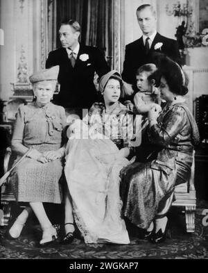 A portrait featuring Elizabeth II, Prince Philip, King George VI, Elizabeth I (the Queen Mother), Queen Mary, and newborn, Princess Anne. Taken during the time of Princess Anne's christening in 1950, brings together multiple generations of British royalty. The photograph captures a historic moment, of the royal lineage with Queen Mary, the reigning King George VI, and the future monarchs Elizabeth II and Princess Anne. Stock Photo