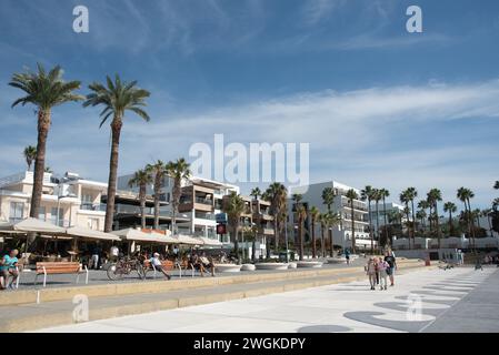 Tourist people walking at footpath in Kato Paphos holiday city resort in Cyprus, Europe. European destinations Stock Photo