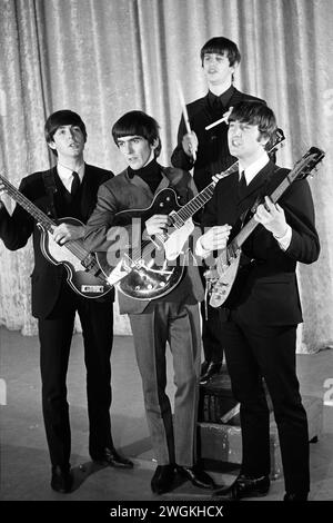 The Beatles pose with their instruments following afternoon rehearsals on the stage of The Ed Sullivan Show, Saturday, February 8, 1964   CBS' The Ed Sullivan Show  CBS Studio 50, Broadway and West 53rd Street, New York, NY.     (L to R): Paul McCartney, George Harrison, Ringo Starr, John Lennon Stock Photo