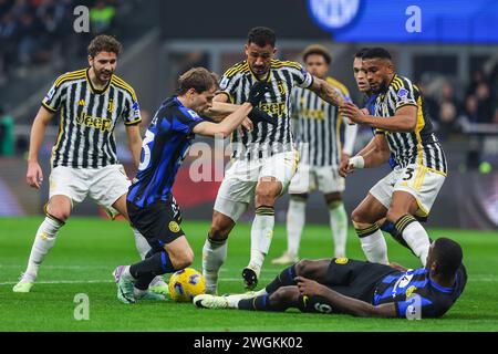 Milan, Italy. 04th Feb, 2024. Nicolo Barella of FC Internazionale and Marcus Thuram of FC Internazionale compete for the ball with Gleison Bremer of Juventus FC, Luiz da Silva Danilo of Juventus FC and Manuel Locatelli of Juventus FC during Serie A 2023/24 football match between FC Internazionale and Juventus FC at Giuseppe Meazza Stadium, Milan, Italy on February 04, 2024 Credit: Independent Photo Agency/Alamy Live News Stock Photo