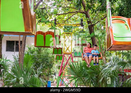 Merida Mexico,Parque Zoologico del Centenario centennial public park,amusement fantasy,aerial chair lift,woman women lady female,adult adults,resident Stock Photo