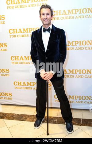 Aaron Lazar, an award-winning actor and singer, receives the Essey Spotlight Award for his commitment to raising ALS awareness around the globe during the ALS Golden West’s “Champions for Cures and Care” gala on January 19, 2024 at Hilton Hotel, Los Angeles, California. After receiving the award, Lazar, who was diagnosed with ALS (amyotrophic lateral sclerosis) a couple years ago, performed an excerpt of the song 'The Impossible Dream' from   ''Man of La Mancha.''  Photo By Jana Ašenbrenerová Stock Photo