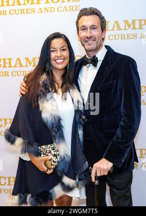 Aaron Lazar, an award-winning actor and singer, poses for a portrait with his partner, Nawal Bengholam. Lazar received the Essey Spotlight Award for his commitment to raising ALS awareness around the globe during the ALS Golden West’s “Champions for Cures and Care” gala on January 19, 2024 at Hilton Hotel, Los Angeles, California. After receiving the award, Lazar, who was diagnosed with ALS (amyotrophic lateral sclerosis) a couple years ago, performed an excerpt of the song 'The Impossible Dream' from   ''Man of La Mancha.''  Photo By Jana Ašenbrenerová Stock Photo