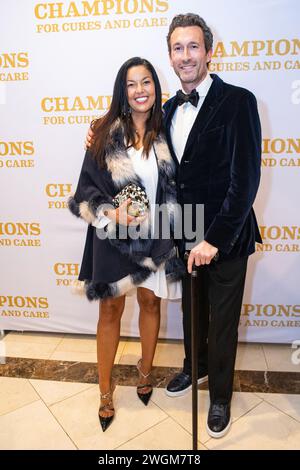 Aaron Lazar, an award-winning actor and singer, poses for a portrait with his partner, Nawal Bengholam. Lazar received the Essey Spotlight Award for his commitment to raising ALS awareness around the globe during the ALS Golden West’s “Champions for Cures and Care” gala on January 19, 2024 at Hilton Hotel, Los Angeles, California. After receiving the award, Lazar, who was diagnosed with ALS (amyotrophic lateral sclerosis) a couple years ago, performed an excerpt of the song 'The Impossible Dream' from   ''Man of La Mancha.''  Photo By Jana Ašenbrenerová Stock Photo