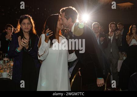 Aaron Lazar, an award-winning actor and singer, kisses his partner, Nawal Bengholam, as he makes his way towards stage to receive the Essey Spotlight Award for his commitment to raising ALS awareness around the globe during the ALS Golden West’s “Champions for Cures and Care” gala on January 19, 2024 at Hilton Hotel, Los Angeles, California. After receiving the award, Lazar, who was diagnosed with ALS (amyotrophic lateral sclerosis) a couple years ago, performed an excerpt of the song 'The Impossible Dream' from   ''Man of La Mancha.''  Photo By Jana Ašenbrenerová Stock Photo