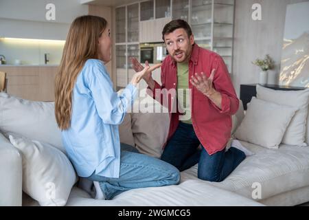 Reproachful wife shouting at delinquent husband. Misunderstanding and ...