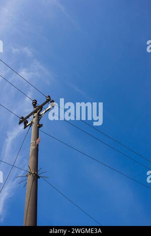 Photo of a high voltage power pole with a blue sky Stock Photo - Alamy