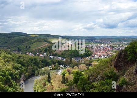 Bad Munster, Germany - May 12, 2021: Rheingrafenstein Castle on a hill above Bad Munster and the Nahe River, surrounded by green trees and hills on a Stock Photo