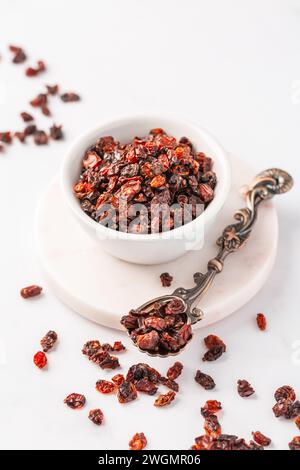 Pile of dried Berberis vulgaris, common barberry, European barberry or barberry. Edible herbal medicinal red fruit plant. Stock Photo