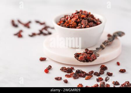 Pile of dried Berberis vulgaris, common barberry, European barberry or barberry. Edible herbal medicinal red fruit plant. Stock Photo